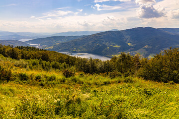 Panoramic view of Beskidy Mountains surrounding Zywieckie and Miedzybrodzkie Lake seen from Gora Zar mountain near Zywiec in Silesia region of Poland