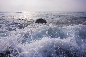 waves are hitting on the rocks with slow shutter speed. Sea water waves with slow shutter speed