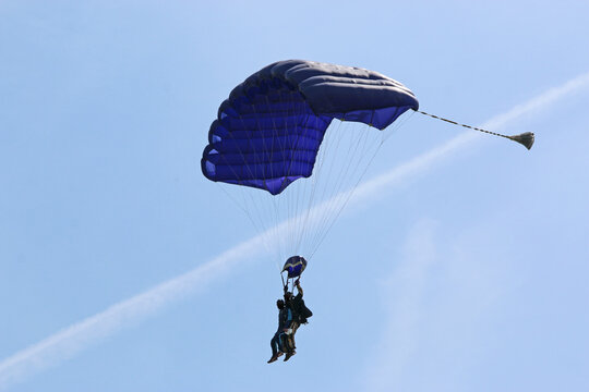 Skydiver in a blue sky	