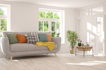 White living room with sofa and summer landscape in window. Scandinavian interior design. 3D illustration