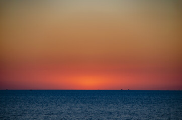 Beautiful sunset on the sea with soft focus and noise.