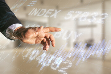 Multi exposure of trader hand clicks on virtual abstract financial graph interface on blurred...