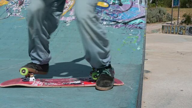 Skate park in Lisbon, skater using the half pipe 
