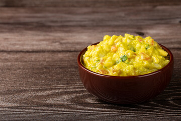 Bowl with guacamole on the table.