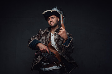Elegant pirate with boarding pistols and serious face
