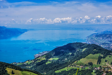 Fototapeta premium Picturesque views of the Alps and Lac Leman (Lake Geneva) from the pass Col de Jaman. The Col de Jaman (1,512 m) is a mountain pass in the western Swiss Alps. Canton of Vaud, Switzerland.