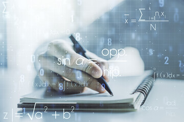 Double exposure of creative scientific formula concept with man hand writing in notebook on background, research and development concept