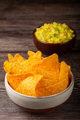 Nachos with guacamole on the table.