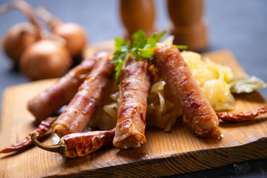 Grilled german sausage links with sauerkraut