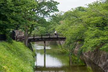 wooden bridge over de river, Japan.