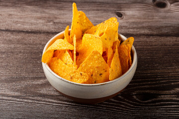 Bowl with nachos on the table.