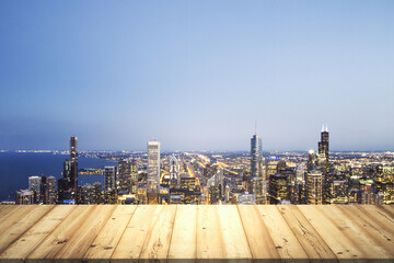 Table top made of wooden dies with Chicago city view at dusk on background, template