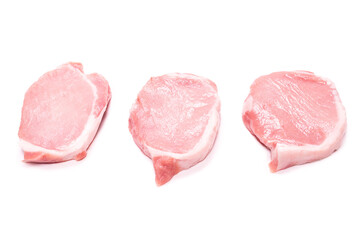 Raw pork pieces isolated on a white background.