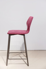 purple bar stool upholstered in velor.