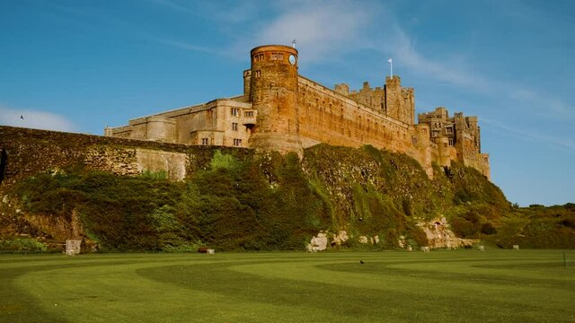 Wide view of Bamburgh Castle, dating to 11th century and the seat of the former Kings of Northumbria, Northumberland, England, UK