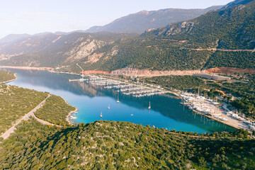 Yacht club with yachts docked in marine bay in Turkey, Kas. Aerial view of sailboats in lagoon.