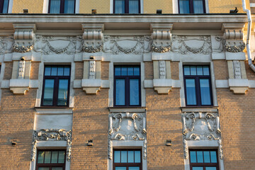 Fototapeta na wymiar Part of the building. Facade and windows.