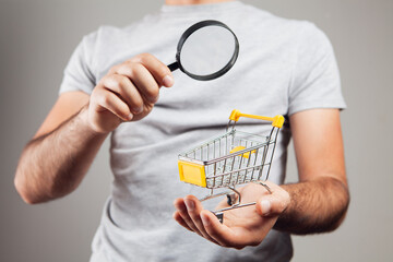 shopping search concept. magnifying glass looking at the basket