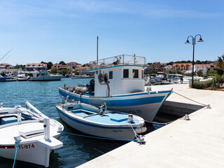 Anchored fishing boats in the port of small fishing village Jezera, located on Murter island,...