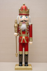 red and gold wooden doll warm light