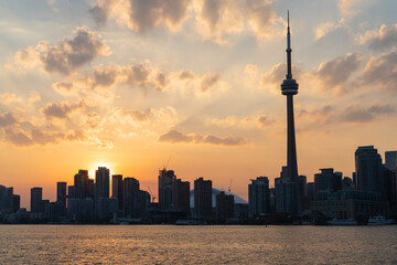 Fototapeta premium Toronto City Skyline at sunset from the ferry in Ontario Canada