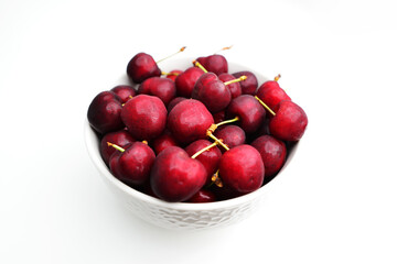 Cherries isolated on white background. Bowl of fresh cherries.