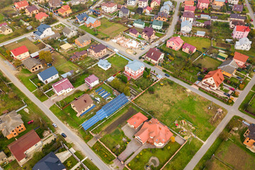 Aerial view of home roofs in residential rural neighborhood area.