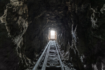 View inside an old scary abandoned gold mine tunnel.  