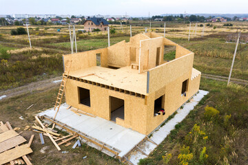 Construction of new and modern modular house. Walls made from composite wooden sip panels with...
