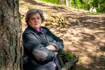 The cheerful mature woman smiled at the photographer.