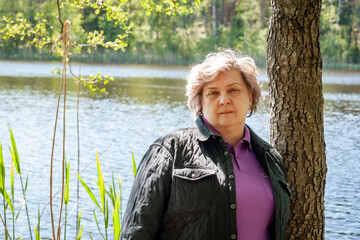 The cheerful mature woman smiled at the photographer.