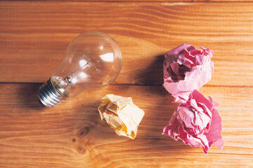 light bulb and crumpled papers