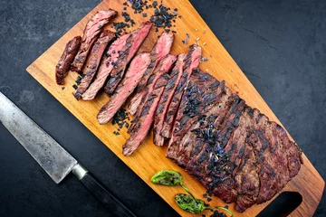 Foto auf Acrylglas Modern style traditional barbecue wagyu bavette steak with green chili and spices served as top view on a wooden design board © HLPhoto