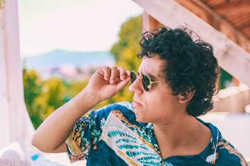 Young man summer portrait with sunglasses