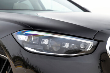 Fototapeta premium Close up of a new car's headlight