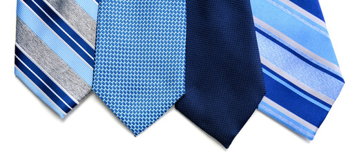 A group of blue neckties on a white background