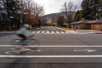 Motion blur of a rider passing on a city street