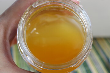 jar of sweet honey and hand