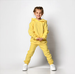 Young beauty casual clothes woman in sweat suit spinning with flying hair motion. Full body length...