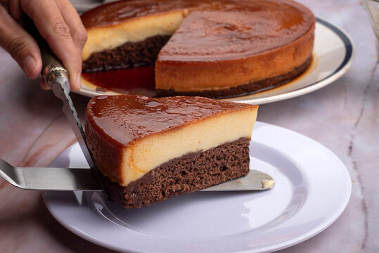 inverted cake chocoflan flan with chocolate sponge cake with cream delicious sweet dessert on counter