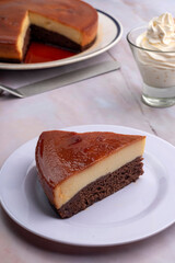 inverted cake chocoflan flan with chocolate sponge cake with cream delicious sweet dessert on counter