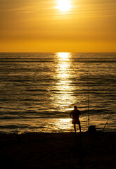 sunset fisherman