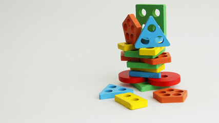 different geometric shapes from toys on a white background. colorful shapes