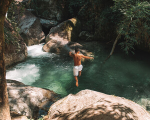 Boy in a waterfall
