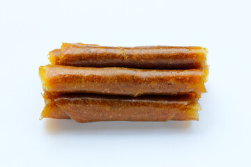 Dried mango paste on white background.