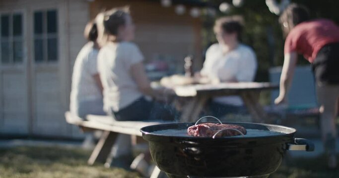 Man covers Wagyu beef steak smoke grill family picnic summer flare