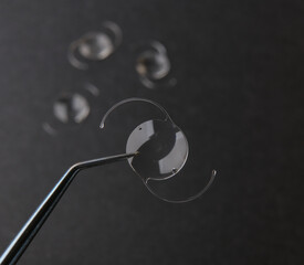 closeup photo of elastic intra ocular lens for cataract surgery