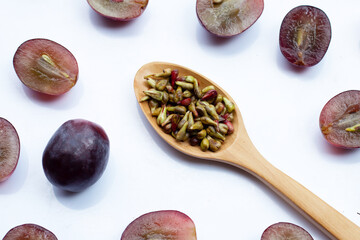 Fresh grape with seeds on white background
