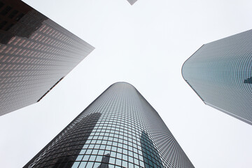 mirrored windows of tall buildings