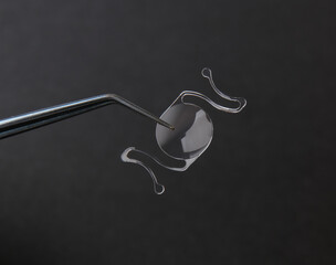 closeup photo of elastic intra ocular lens for cataract surgery - obrazy, fototapety, plakaty